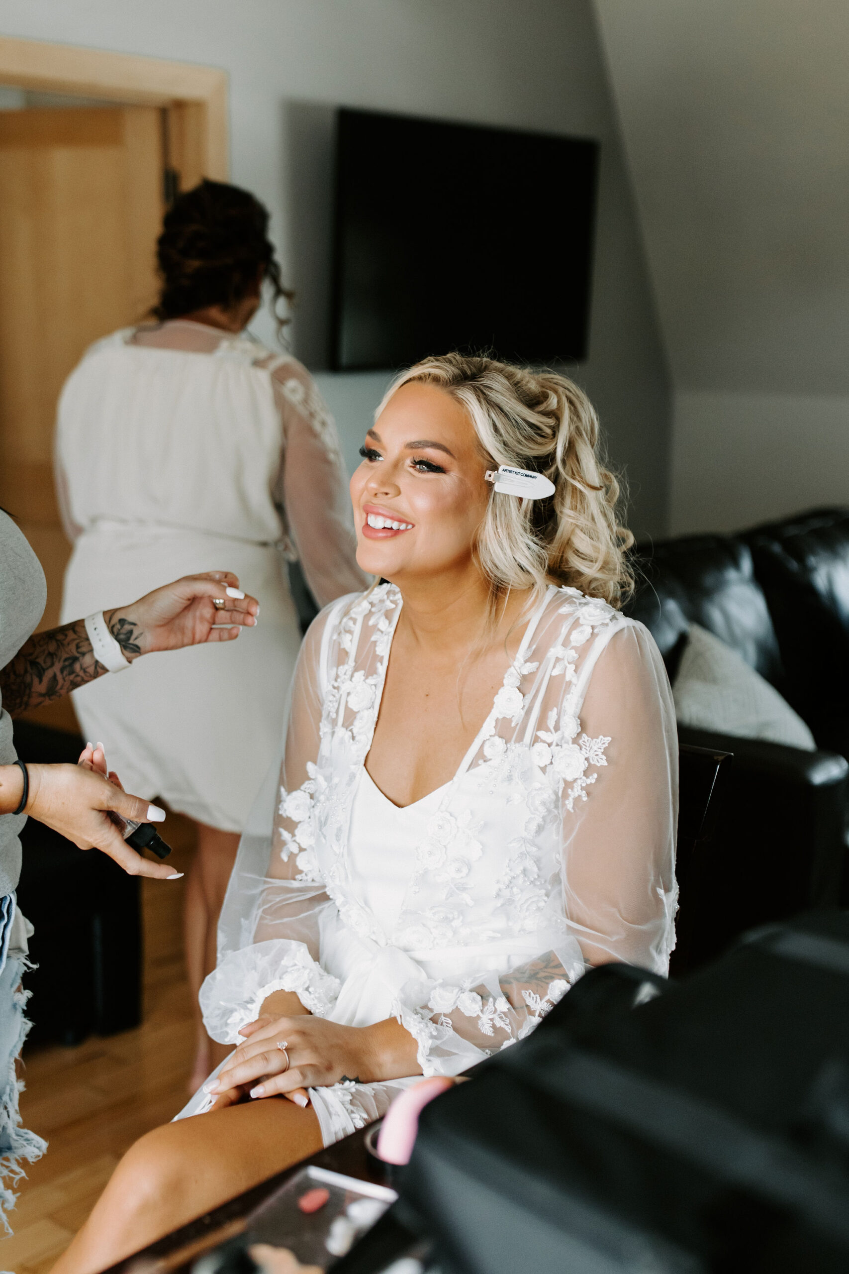 bride getting ready with lash extensions on